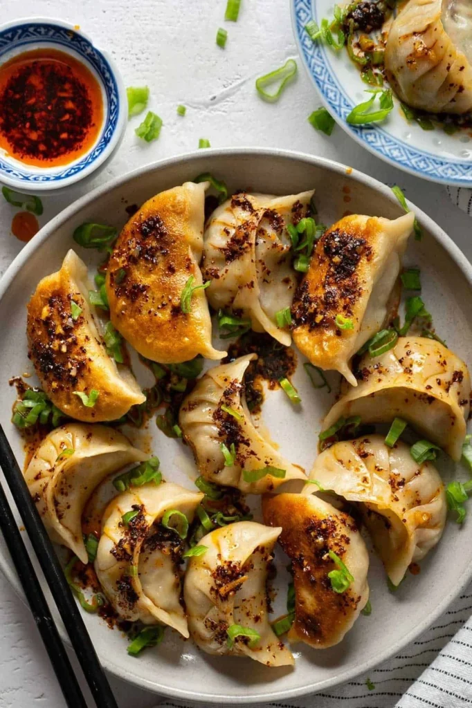 Shrimp Gyoza & Spicy Salmon on Crispy Rice Paper